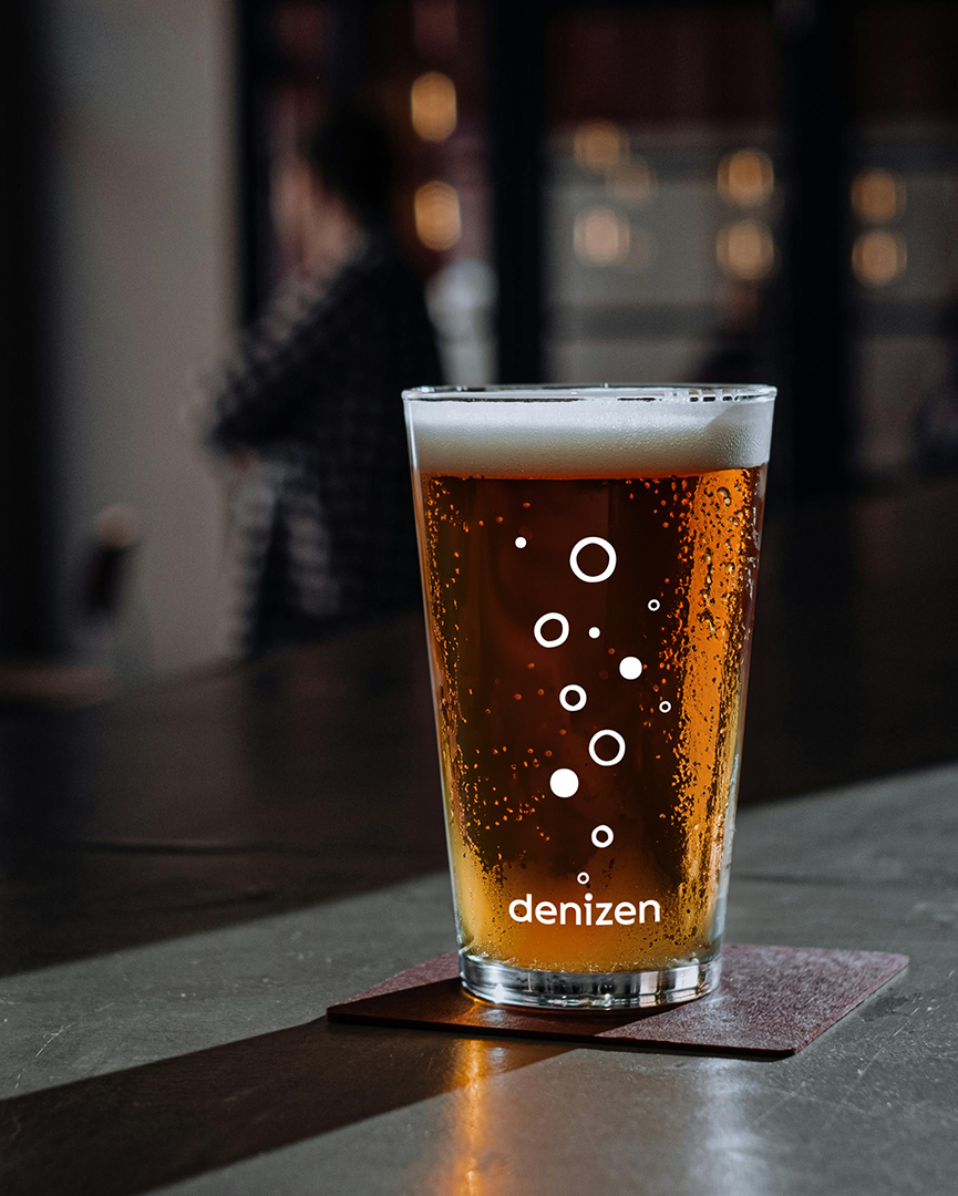 beer glass design with illustrated bubbles and logo